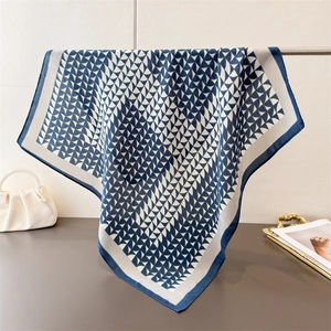 Elegant blue and white geometric fan pattern cotton-linen silk scarf on metal hanger