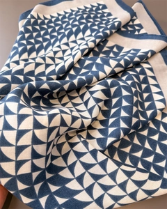 Close-up of navy and beige herringbone pattern on soft cotton linen blend scarf