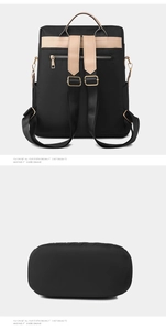 Detail of black nylon backpack with brown leather straps and back anti-theft zipper pocket