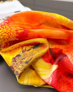 Macro shot of colorful floral print faux silk scarf with elegant twill texture detail