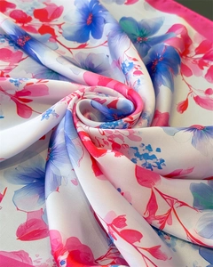 Macro detail of silk-like floral square scarf with pink and blue watercolor flower print