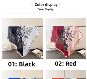 Detail display of large square silk scarves with rose floral prints in black and red