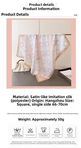 Close-up of square silk satin scarf with beige circle pattern and brown border detail