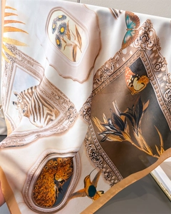 Detail of silk-feel scarf showing retro European frame prints and zebra floral patterns