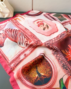 Detail of silk-like scarf with vintage floral, zebra, and bird art prints and soft texture