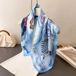 Retro light blue silk-like square scarf featuring zebra and butterfly patterns on a hanger