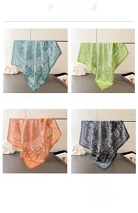 Four-color display of paisley square silk scarves in green, orange, and black options