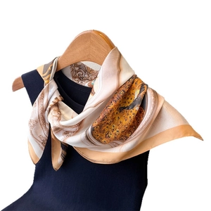 Elegant silk-like square scarf with retro peacock feather print in gold and cream