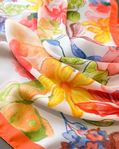 Detailed macro view of floral print chiffon scarf showing artistic watercolor patterns