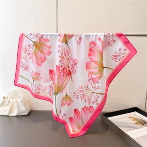 Floral print silk scarf with pink flower pattern and vibrant fuchsia borders