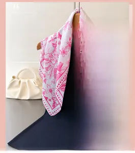Detailed view of elegant bird and floral print on white faux silk square scarf fabric
