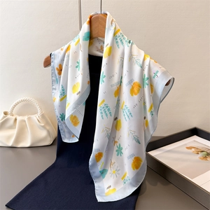 Floral silk square scarf with yellow ginkgo leaves and blue daisies on black background