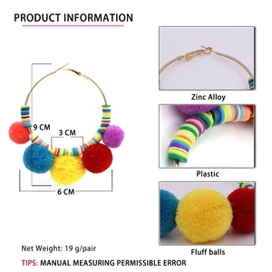Bohemian large hoop earrings with colorful beads and fuzzy pom poms in a 9cm diameter