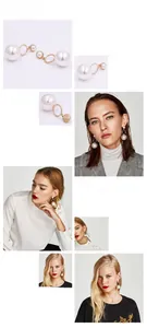 Détails de boucles d'oreilles double perle blanche avec anneaux dorés portées par mannequin
