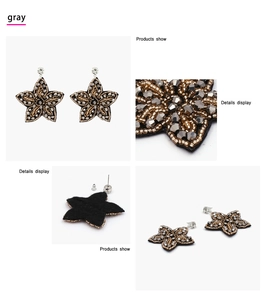 Détail macro de boucles d'oreilles étoile faites main avec perles grises et paillettes