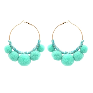 Bohemian gold hoop earrings with mint green beads and decorative soft plush pom poms