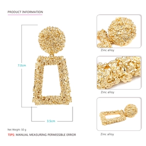 Detail of vintage gold earrings with relief floral texture and exact dimensions shown