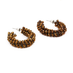 Close-up of Bohemian C-shape hoop earrings crafted with faceted dark bronze beads
