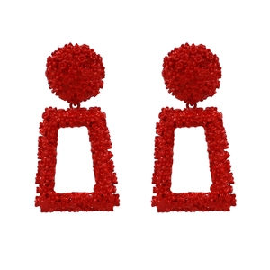 Exaggerated red geometric drop earrings with embossed floral texture on alloy surface
