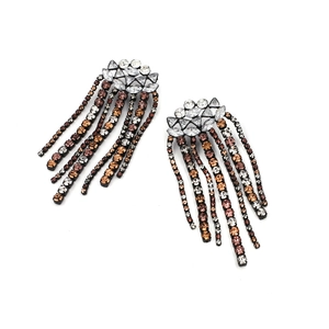 Macro view of gradient rhinestone tassels and crystal studs on alloy drop earrings