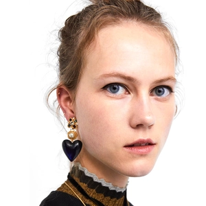 Vintage gold heart drop earrings with pearls and colorful crystals on model