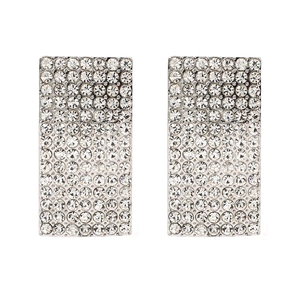 Close-up of geometric pavé-set rectangle stud earrings with sparkling crystals