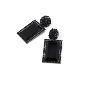 Detailed view of vintage black geometric earrings with rectangular faceted stones and rhinestones