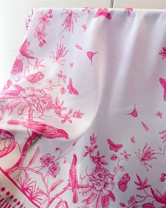 Close-up of elegant white silk scarf with fuchsia floral and bird line art patterns