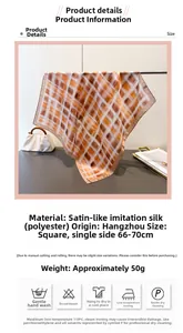 Close-up of the smooth satin finish on the vintage orange and white checkered scarf