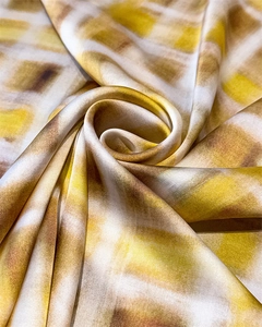 Detail of vintage plaid silk scarf with satin luster folded into a rose flower shape