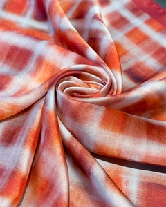 Detailed macro shot of vintage gradient plaid silk scarf showing smooth satin texture