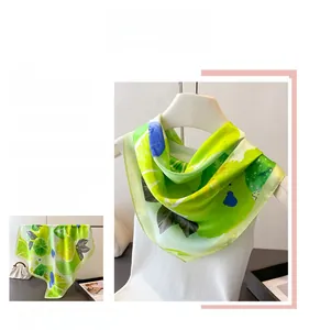 Detail of premium silk-like square scarf with refreshing lemon and blueberry fruit print