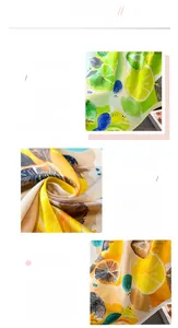 Macro shot of faux silk lemon print scarf showing fine machine-stitched edges and satin texture