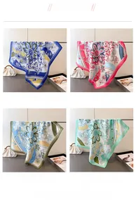 Detail view showing four floral print silk scarves in blue, pink, green, and mint tones