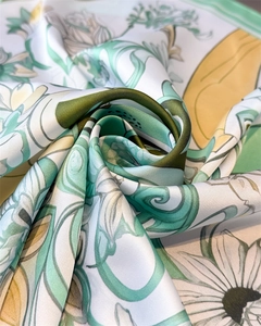 Close-up of silk scarf showing floral patterns and detailed twill weaving texture