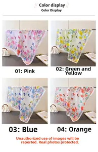 Detail view of butterfly print silk scarves in pink, yellow, blue and orange colors
