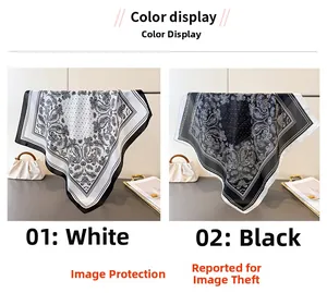 Detail of white and black paisley satin scarves with elegant silk-like glossy finish