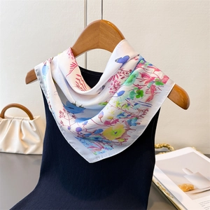 Silk-feel butterfly print square scarf styled on a hanger with a fashion handbag