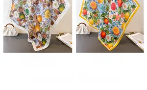 Detail of floral printed square scarves showing lemon and citrus pattern in green and yellow
