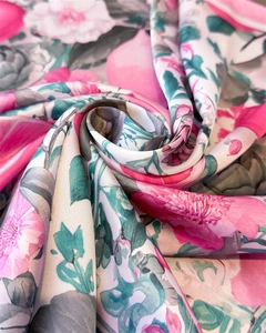 Detailed macro view of the silky fabric texture with vibrant floral and fruit patterns