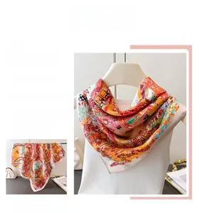 Detail of vibrant vintage floral print on silky satin square scarf for women