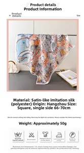 Macro detail of elegant satin square scarf featuring hot air balloon and architecture prints