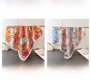 Detail of printed silk scarves featuring hot air balloons and European architecture patterns