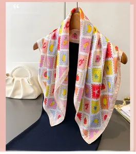 Close-up of elegant silk scarf with stamp patterns featuring fruits and lobster