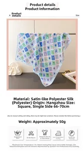 Detail view of satin square scarf featuring marine life prints and light blue borders