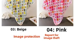 Detailed view of beige and pink silk scarves with vintage stamp patterns on a white bag