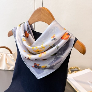 Floral print satin silk square scarf in grey-purple with orange flowers on wood hanger