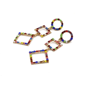 Elegant gold geometric dangle earrings featuring colorful rhinestones on white background