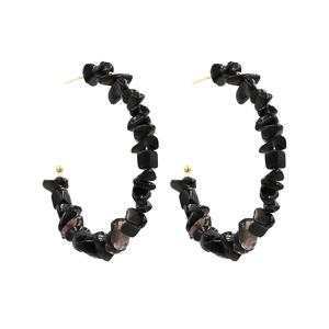 Bohemian C-shaped hoop earrings featuring natural black stone beads and gold metal accents