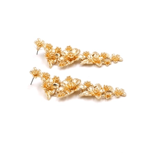 Luxury gold tiered flower drop earrings with intricate metallic petal textures